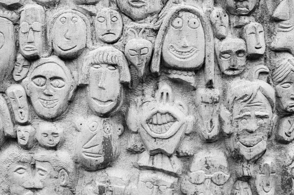 Faces sculpted on wall