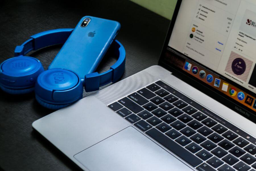 Laptop with blue phone and headset